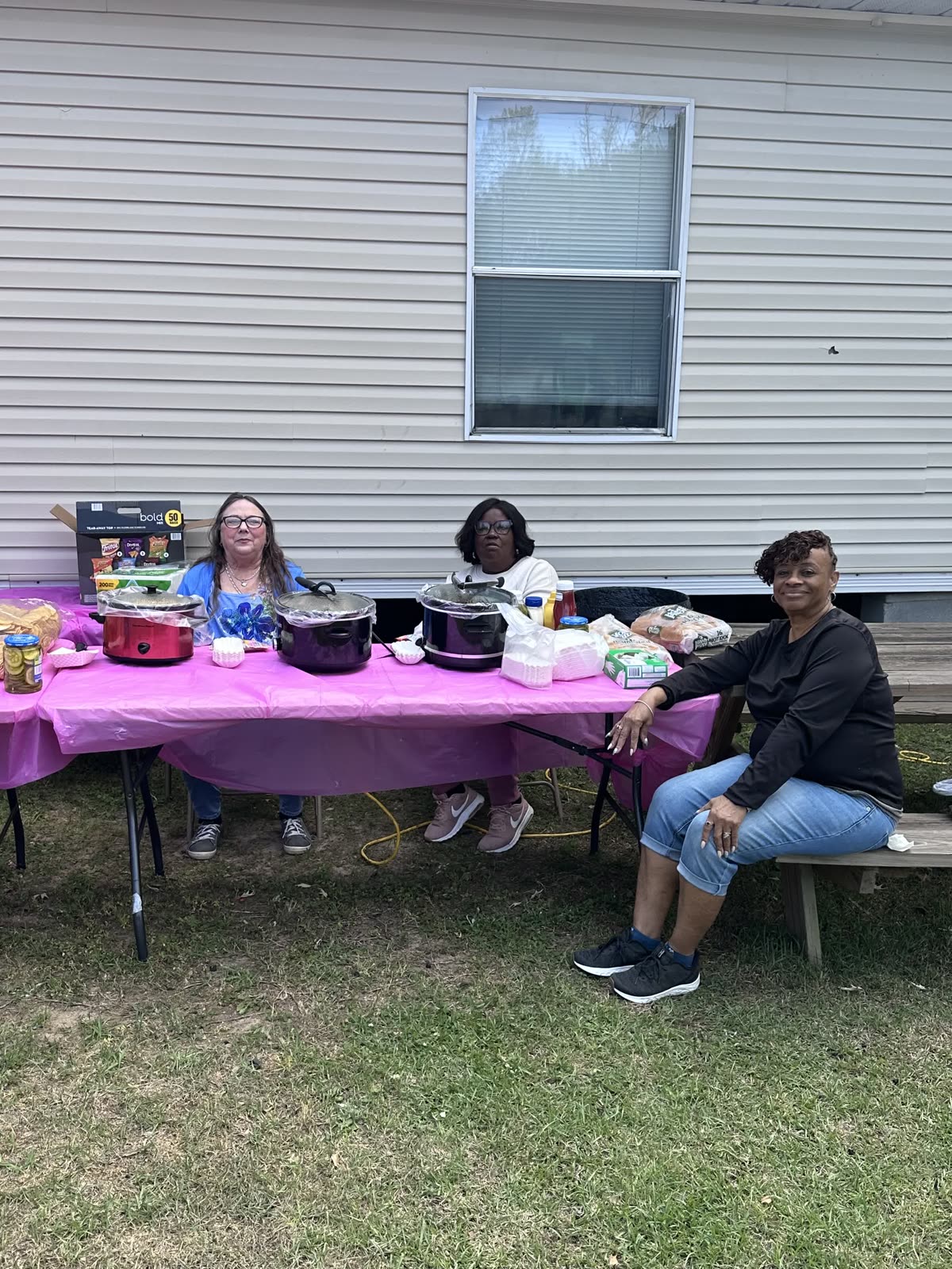 SCC volunteers serving food at an outdoor community event
