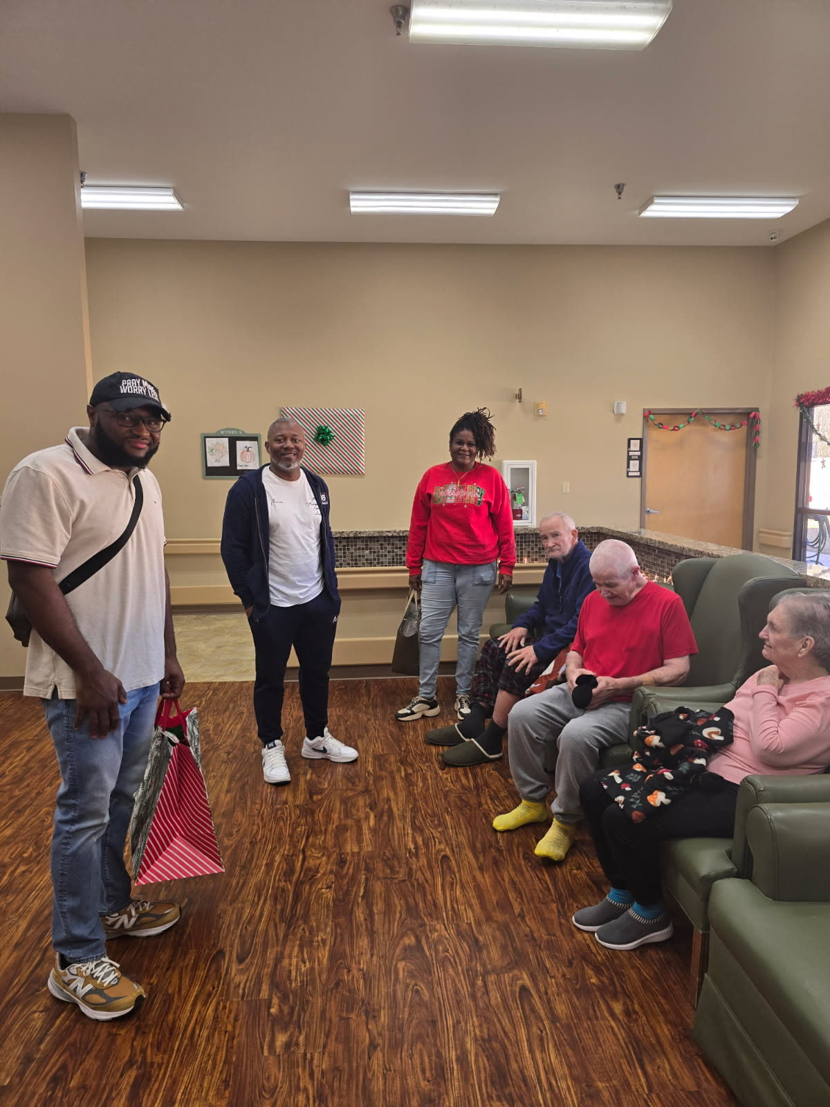 SCC volunteers visiting with community members during a holiday outreach visit