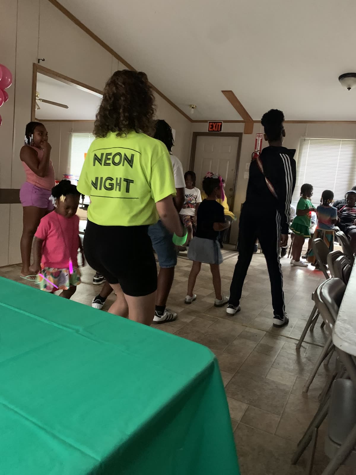 Children enjoying the colorful lights at Neon Night