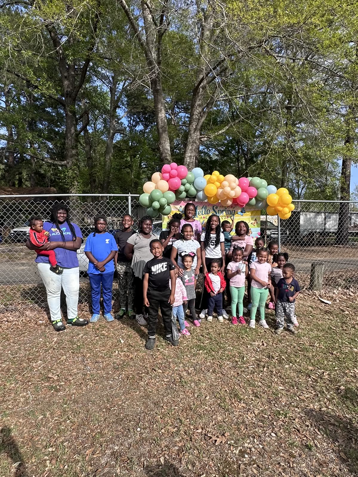 Children and volunteers gathered for a spring celebration at Sabine Community Connection